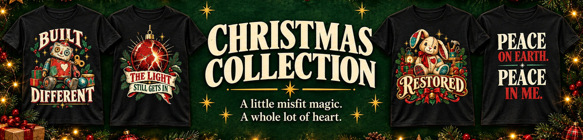 Christmas Collection — A little misfit magic. A whole lot of heart. Four black shirts featuring Built Different, The Light Still Gets In, Restored, and Peace on Earth, Peace in Me.